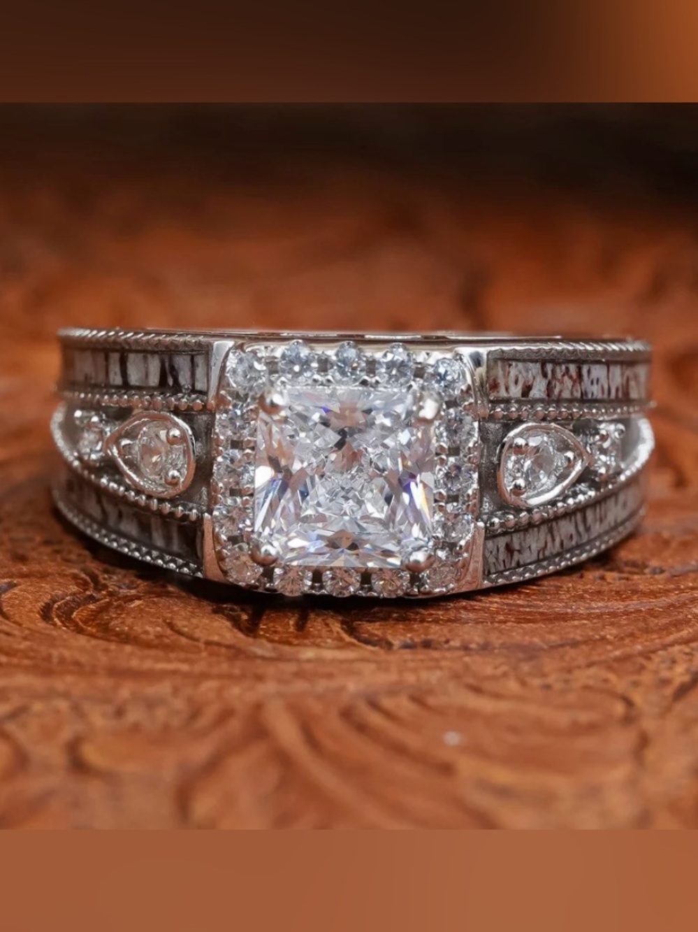 This exquisite ring showcases a stunning genuine antler touch and so much detail